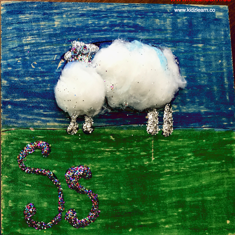 Sheep art on a wooden slab